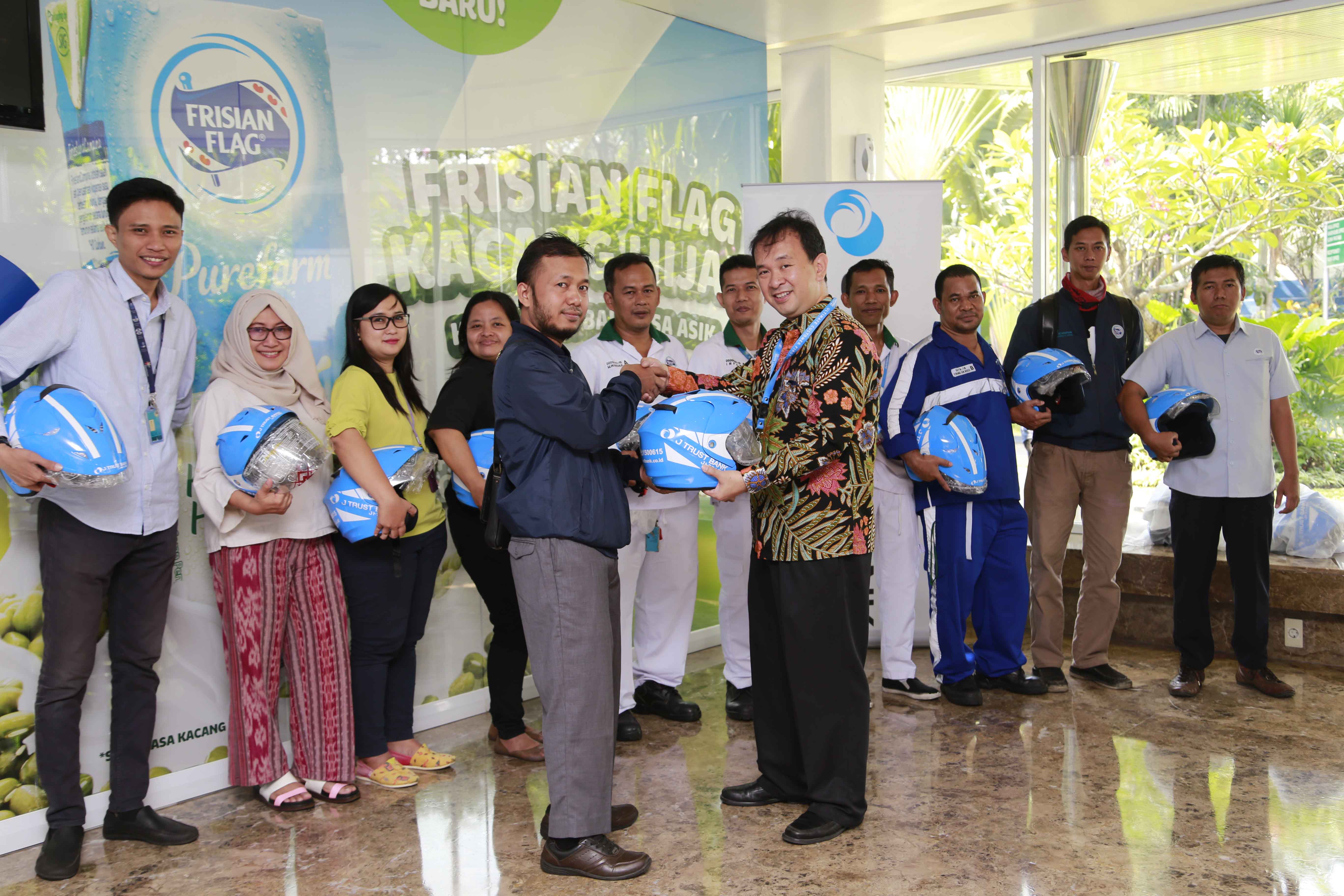 J Trust Bank Handed Helmets to Frisian Flag Employees